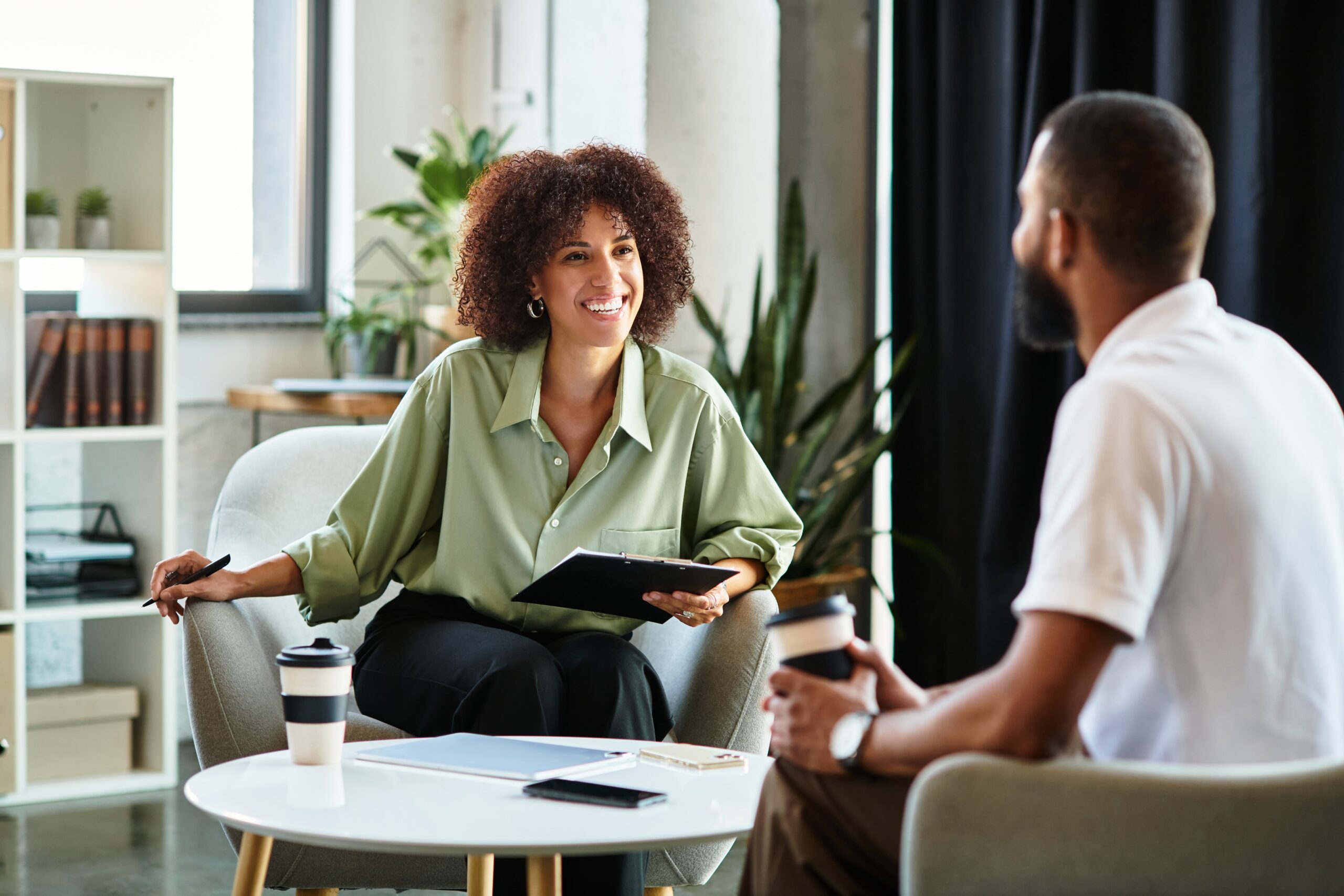 Individual therapy meeting or patient journaling in a calm setting partial hospitalization program recovery session Essence Recovery Center