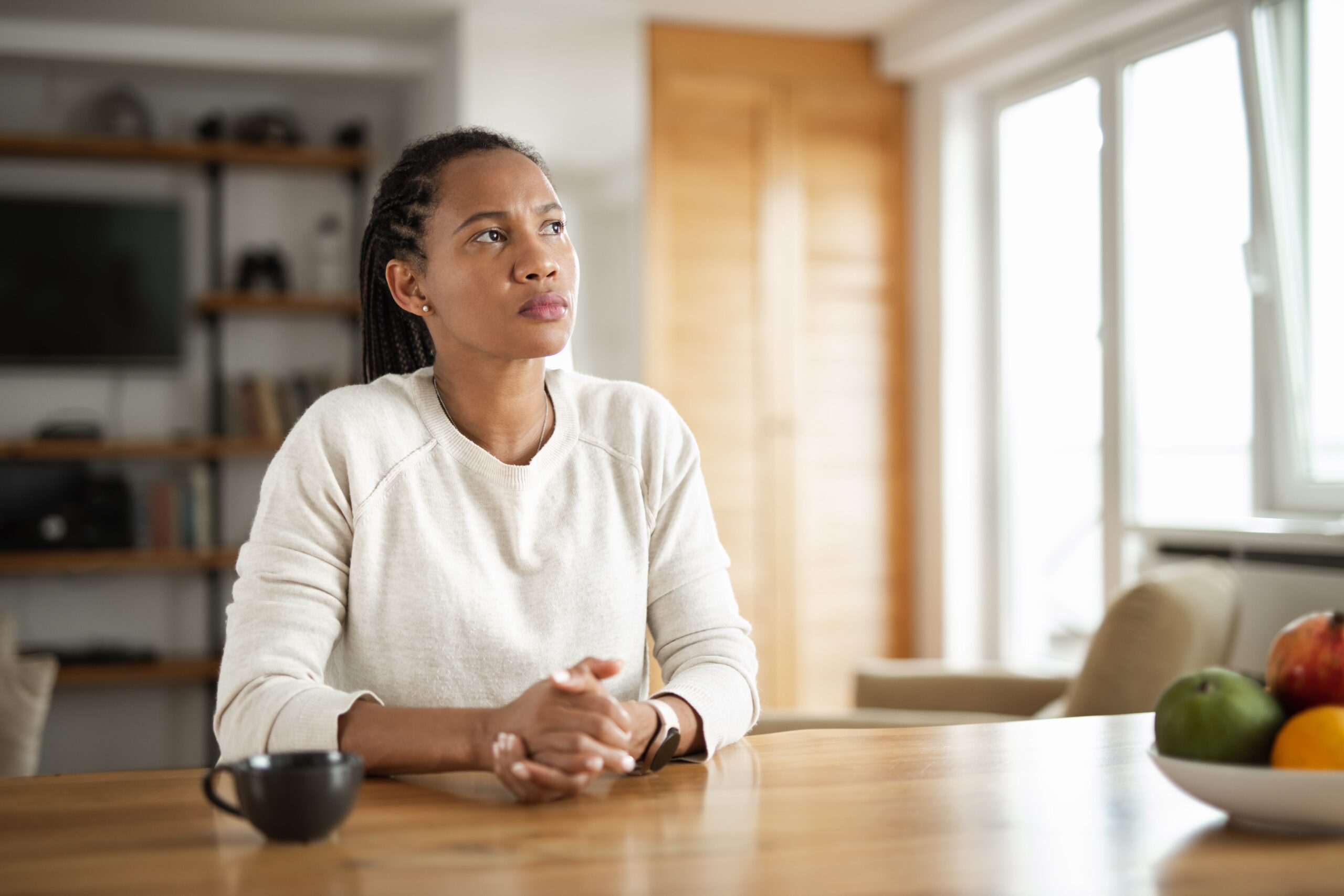 Person reflecting on self-sabotage in sobriety during recovery